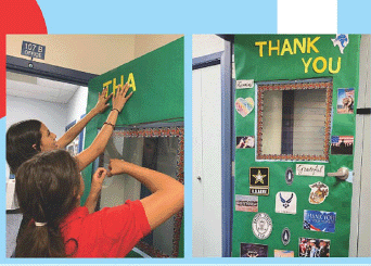 Two girls are decorating a door that says thank you