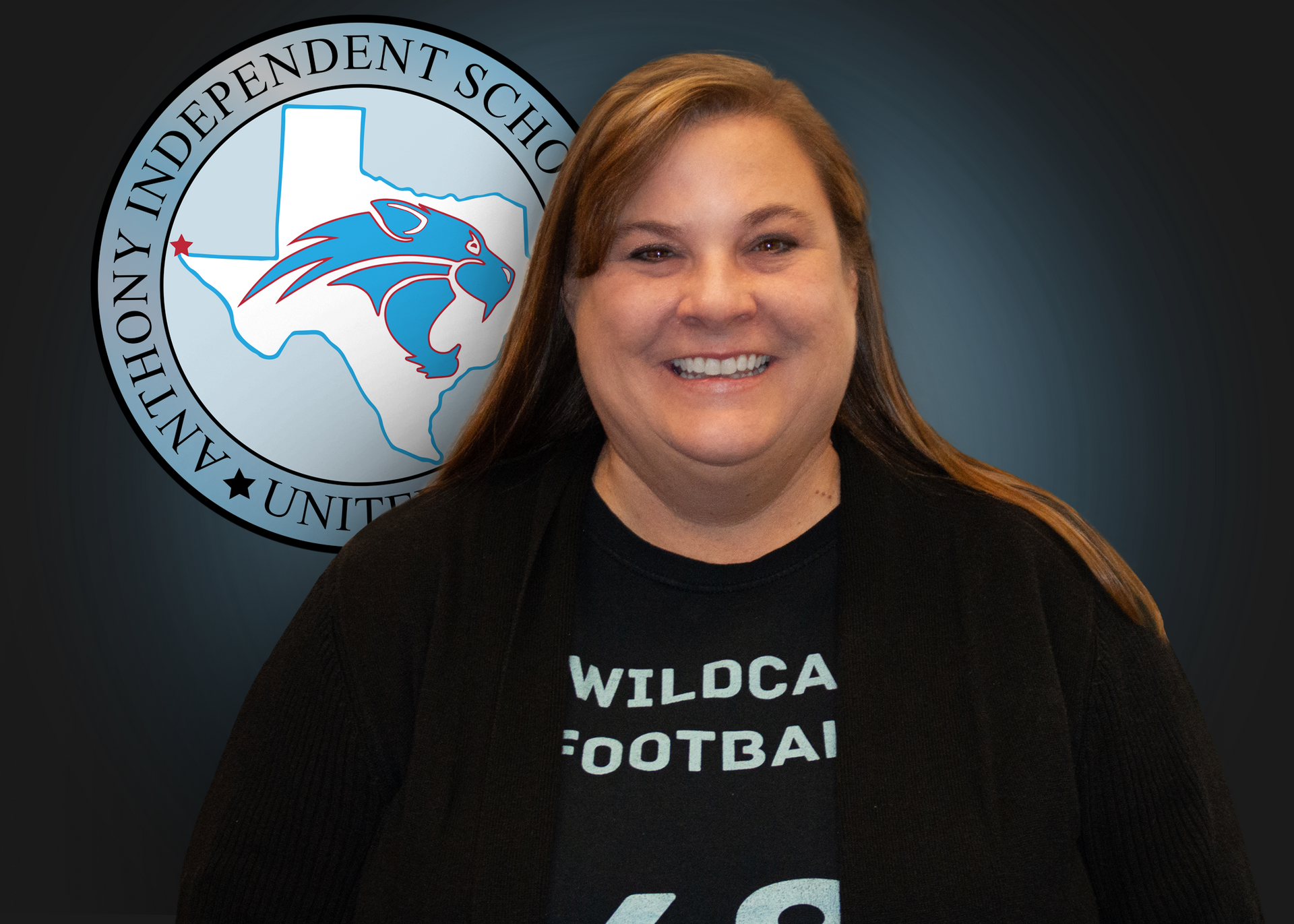 A woman wearing a black shirt that says wildcat football