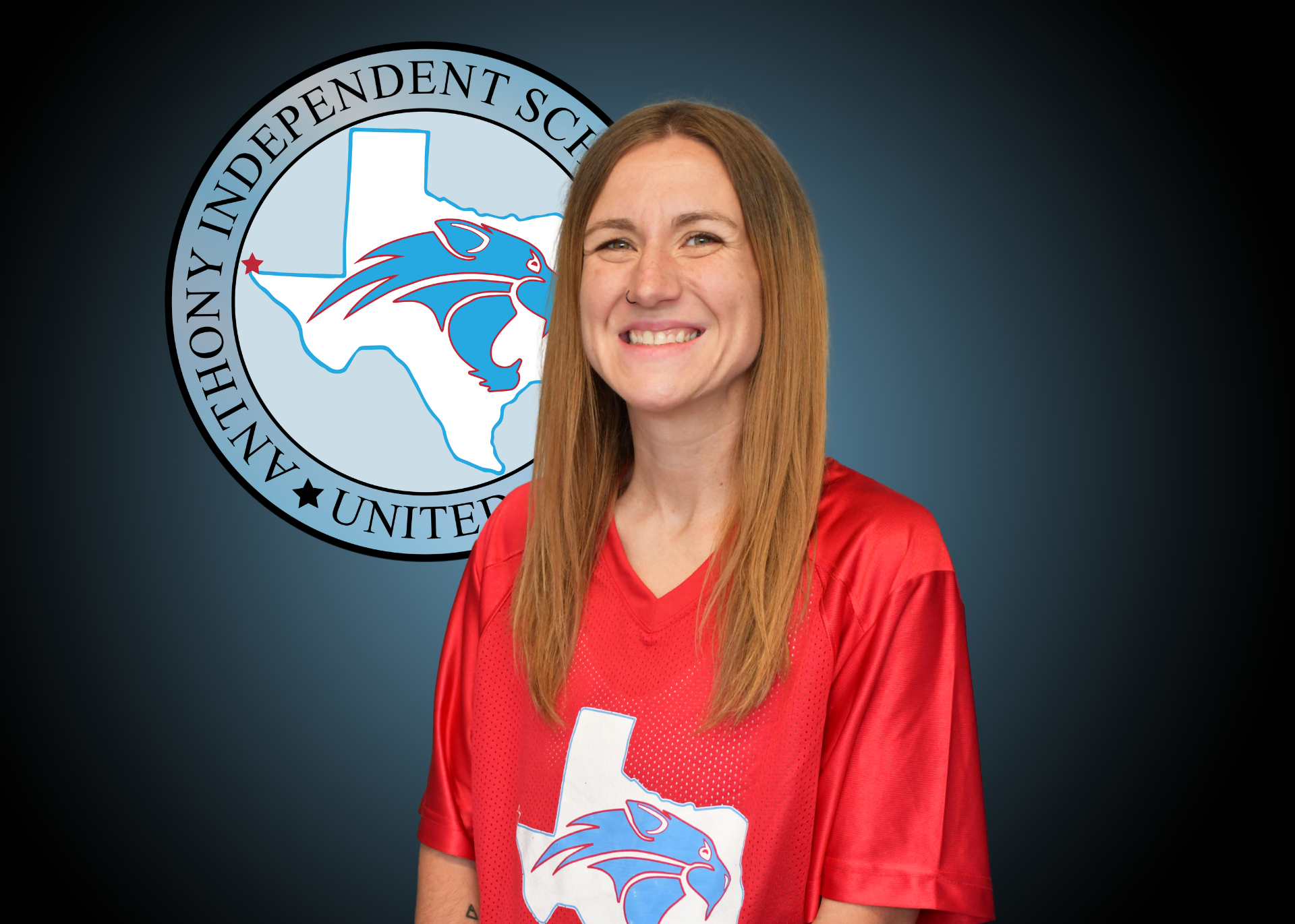 Woman in front of AISD logo