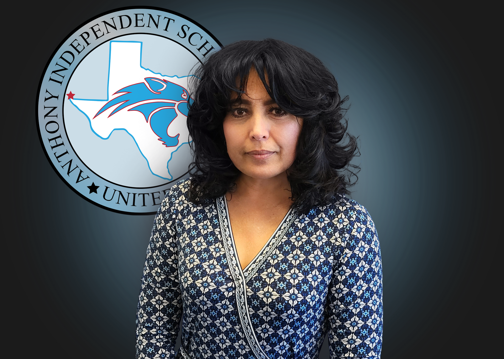 A woman stands in front of an anthony independent school logo