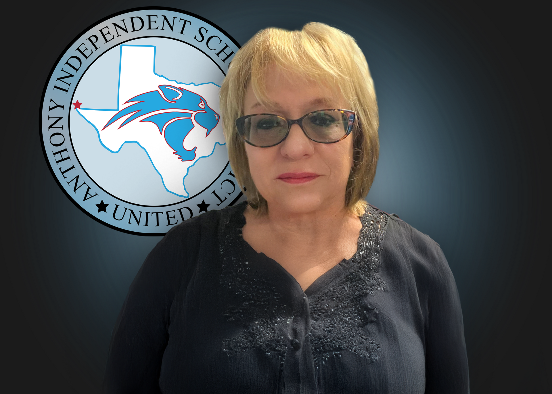 A woman stands in front of a logo for anthony independent school