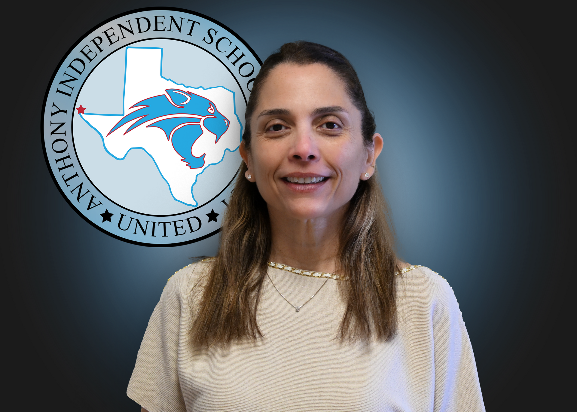 Woman smiling standing in front of Anthony Independent School District Logo