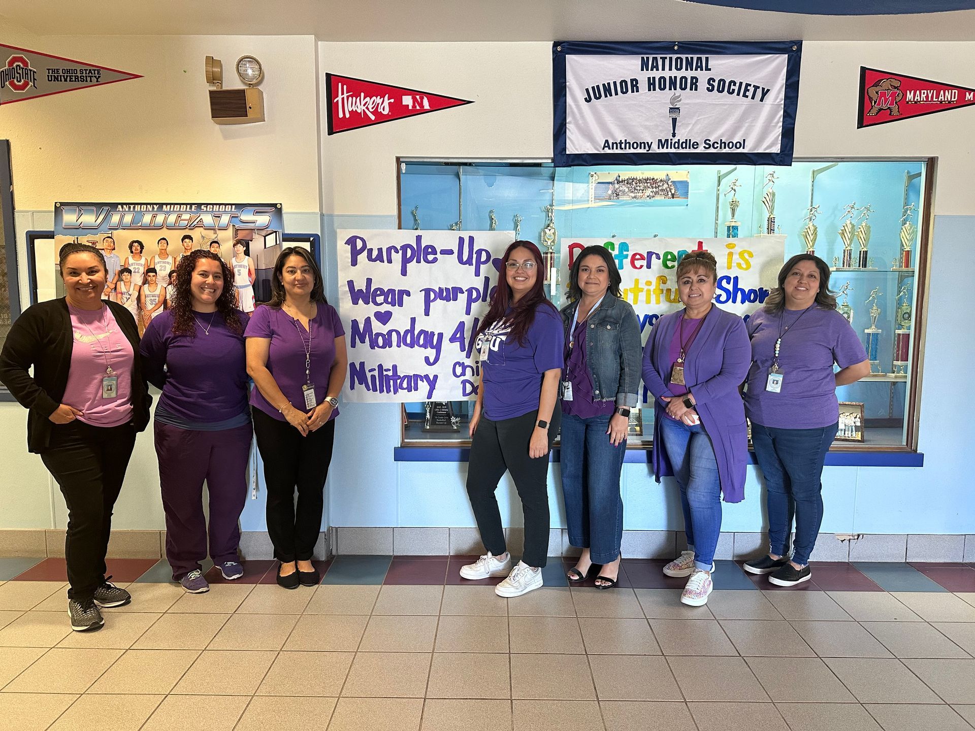 Middle School faculty and staff wearing purple T-shirts in show of support for military families.