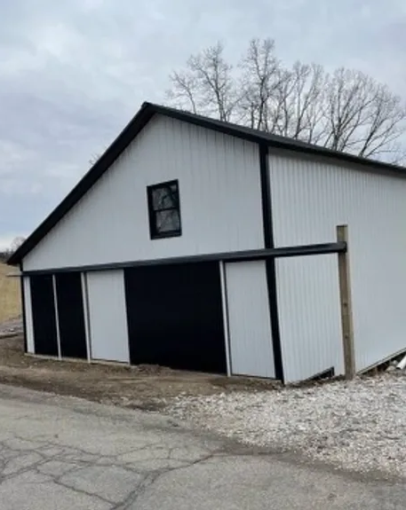 White Barn With Black Doors And A Window - Salineville, OH - Eastern Ohio Builders LLC