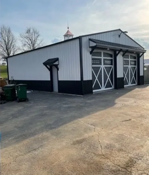 White And Black Building With A Large Garage Door - Salineville, OH - Eastern Ohio Builders LLC