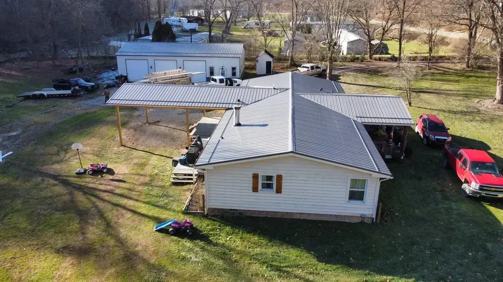 An Aerial View Of A House With  Red Truck Parked In Front Of It - Salineville, OH - Eastern Ohio Builders LLC