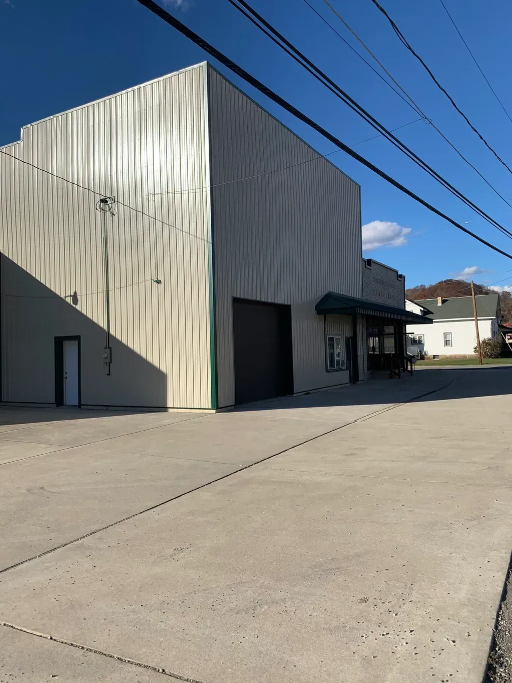 Large White Building with A Black Garage Door - Salineville, OH - Eastern Ohio Builders LLC