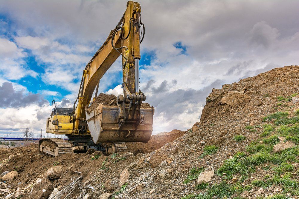 Excavator Carrying Out A Clearing In A Work — Forestry Projects in Coopernook, NSW