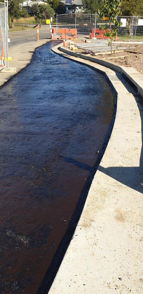 Fresh Bitumen On Road — Projects in Coopernook, NSW