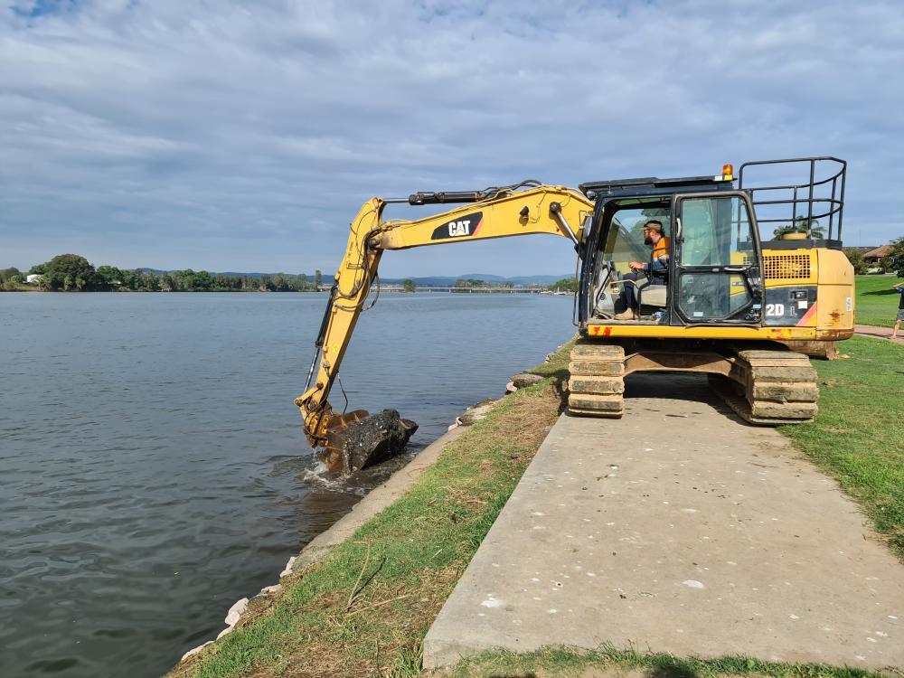 Excavator Lifting Sand From Water — Projects in Coopernook, NSW
