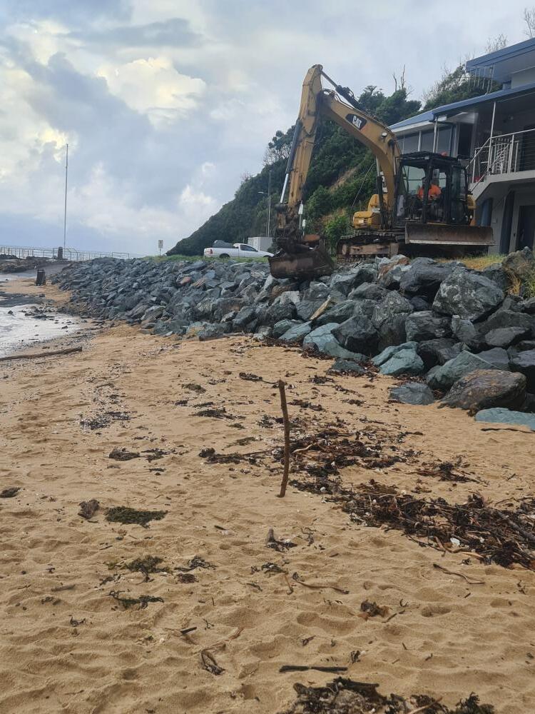 Excavator Moving Large Rocks For Beach Wall — Projects in Coopernook, NSW