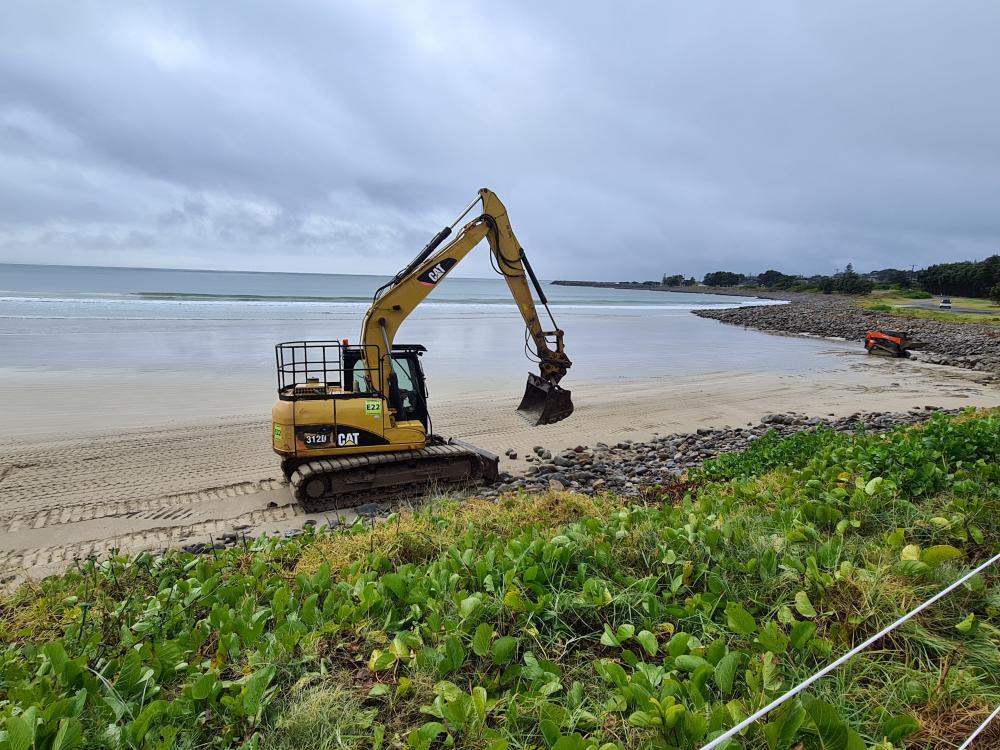 Excavator Moving Rocks On Beach — Projects in Coopernook, NSW