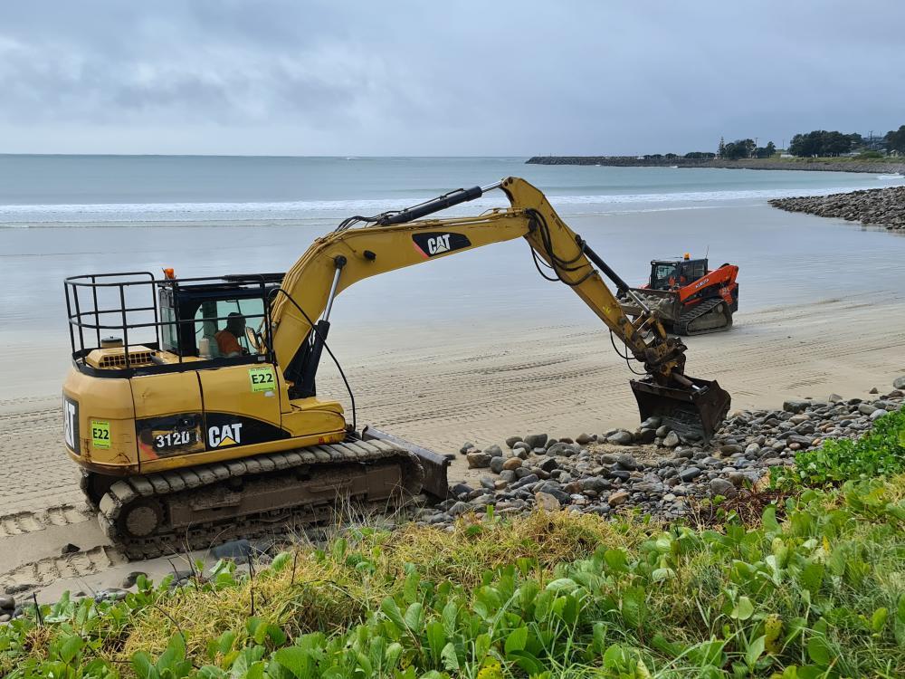 Excavator Moving Rocks On Beach — Projects in Coopernook, NSW