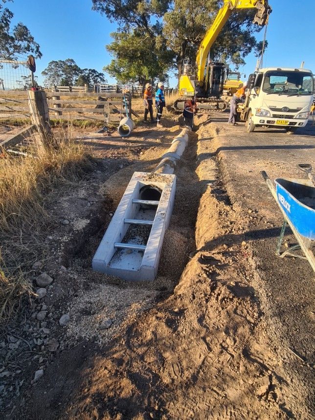 Excavator Digging a Hole — Earthmoving & Excavation in Bulahdelah, NSW
