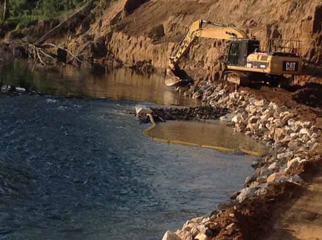 Excavator Near Water — Earthmoving & Excavation in Old Bar, NSW