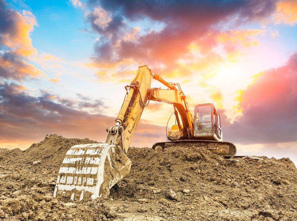 Excavator In Construction Site — Earthmoving & Excavation in Forster, NSW
