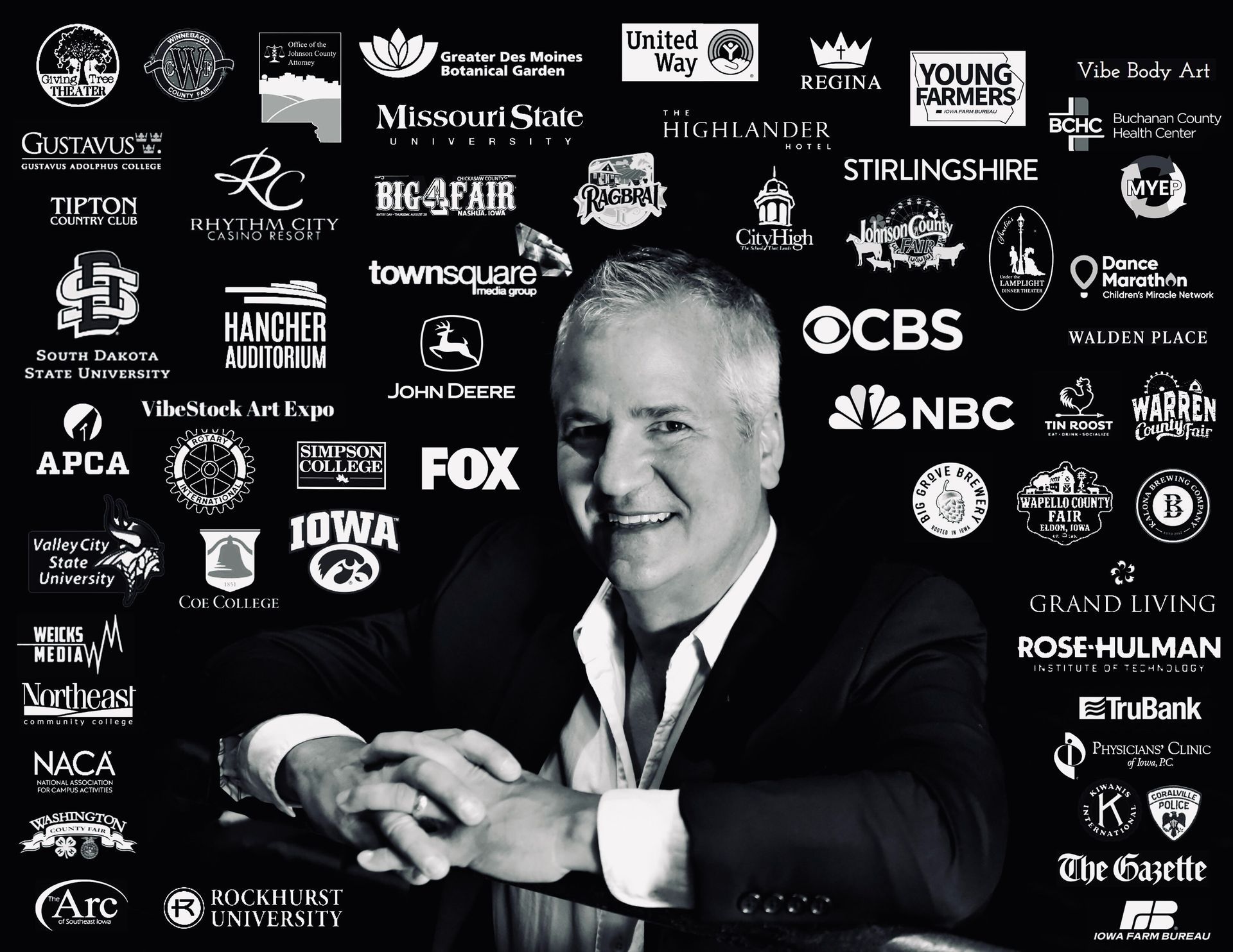 A man in a blue shirt is leaning on a railing