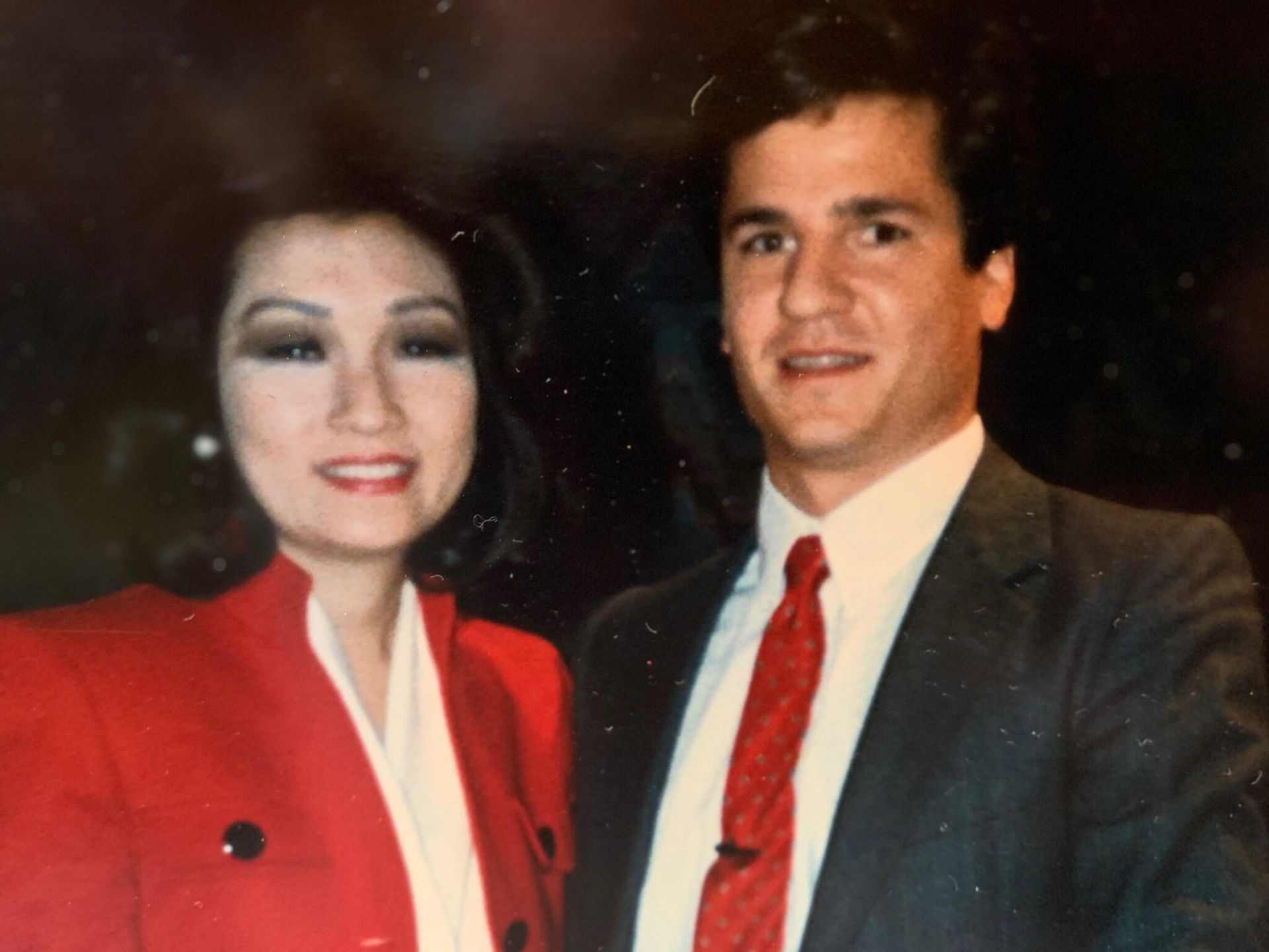 A man and a woman are posing for a picture together