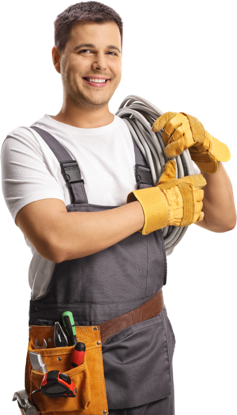 electrician in overalls is holding a hose and smiling 