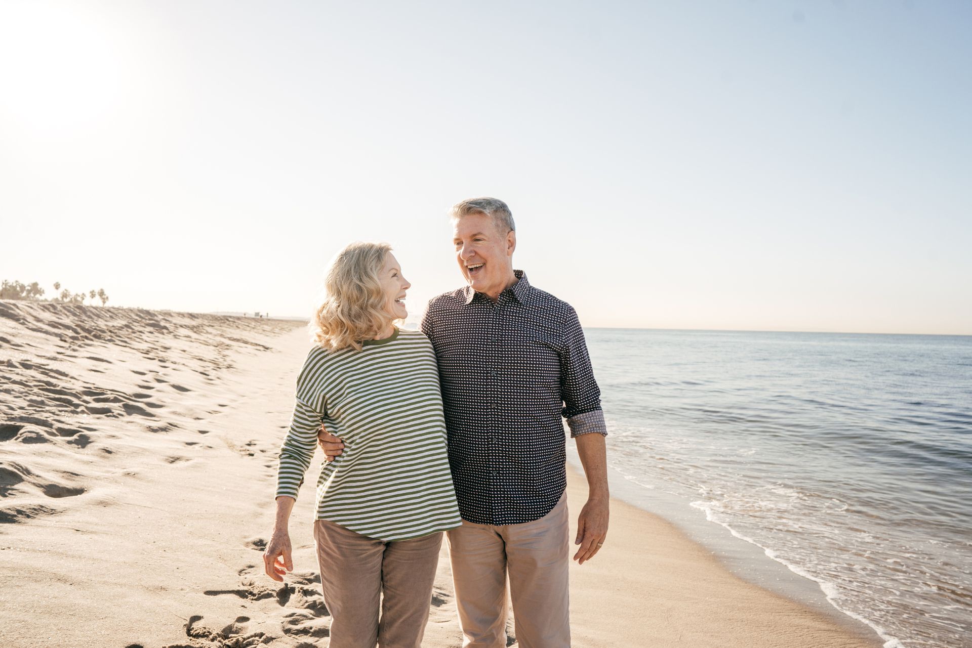 Married Couple Laughing While At The Beach - Richmond, VA - Eye Care Center of Virginia
