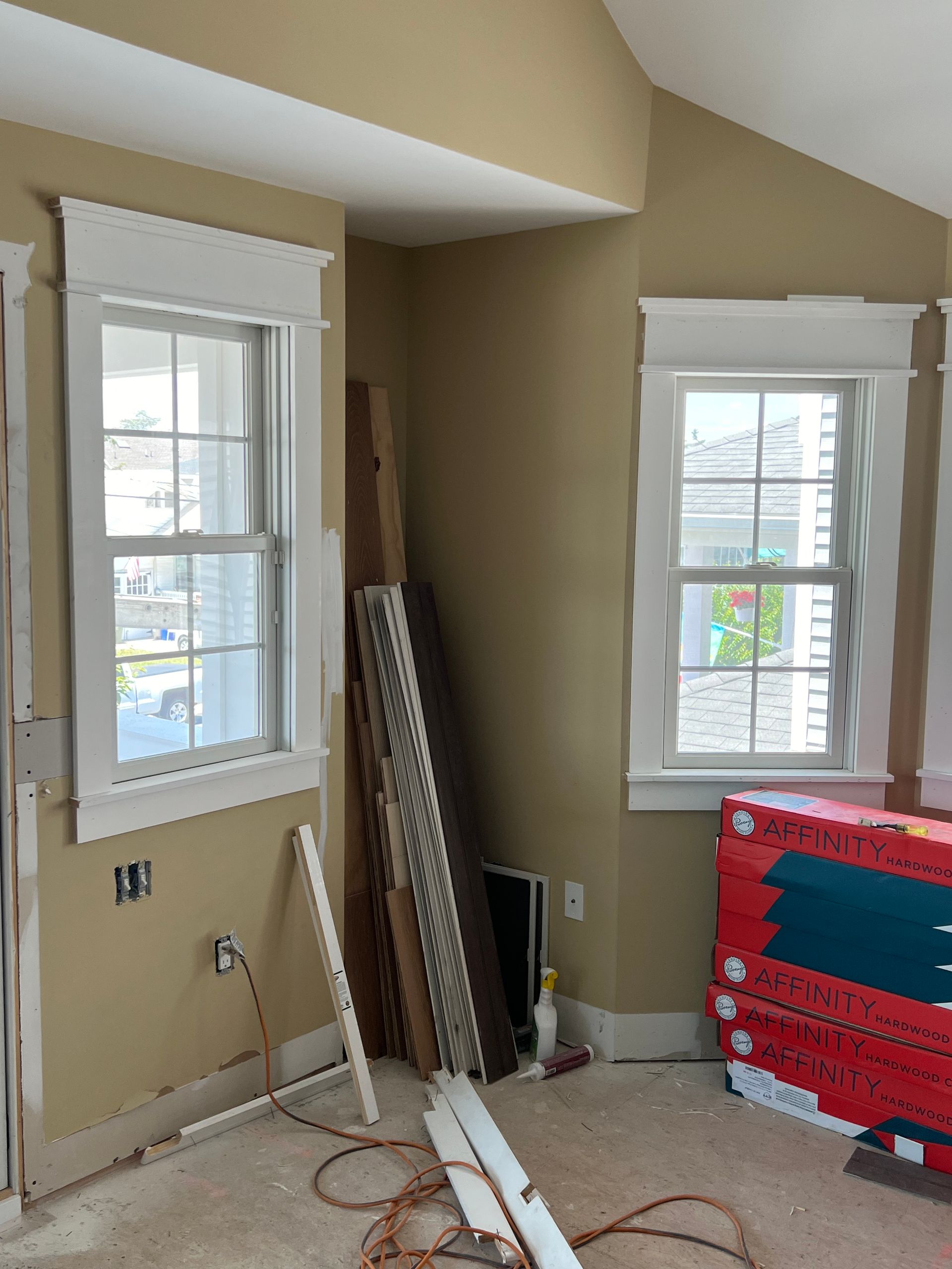 A room with a lot of windows and a box that says ' a ' on it