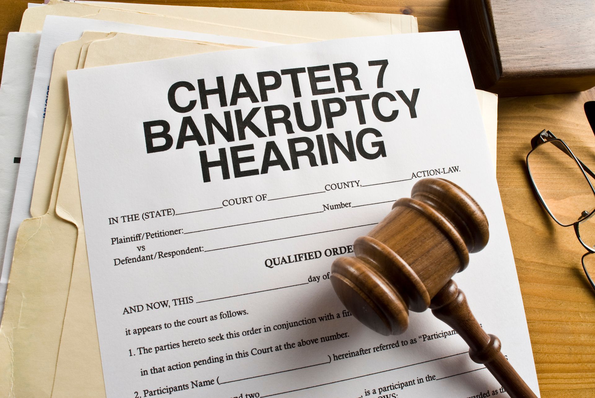 Bankruptcy Chapter 7 paperwork below a gavel. Bankruptcy Chapter 7 paperwork below a gavel.