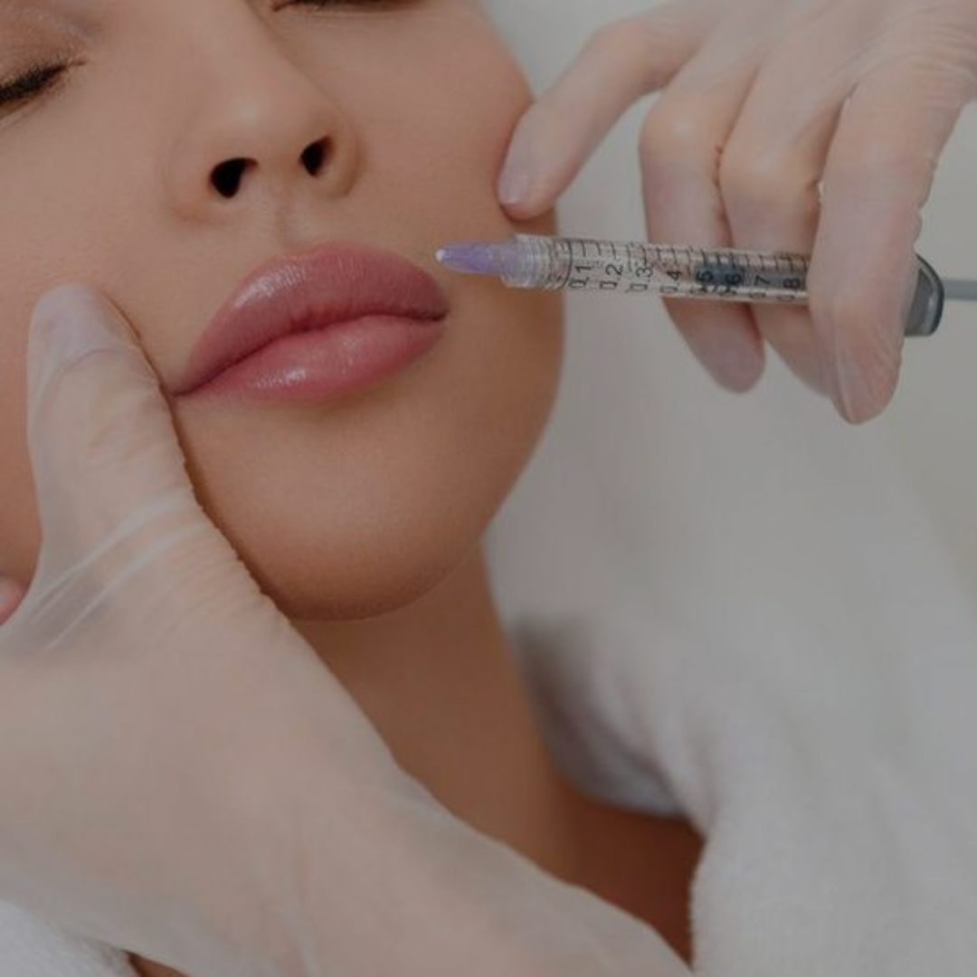 A woman is getting an injection in her lip
