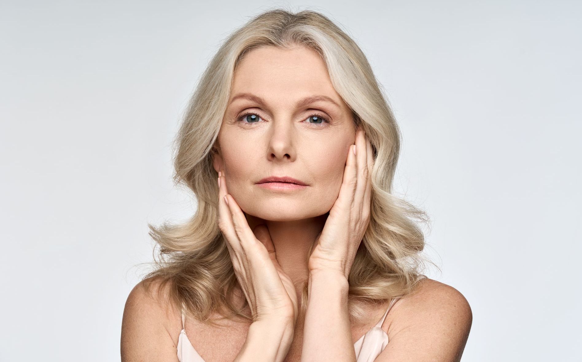 A woman is getting a botox injection in her face.