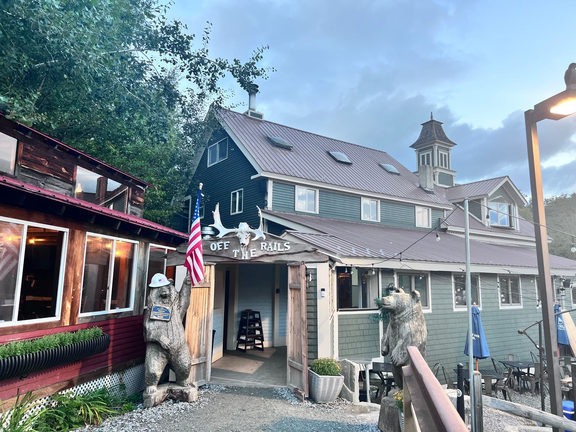 A large building with a statue of a bear in front of it.