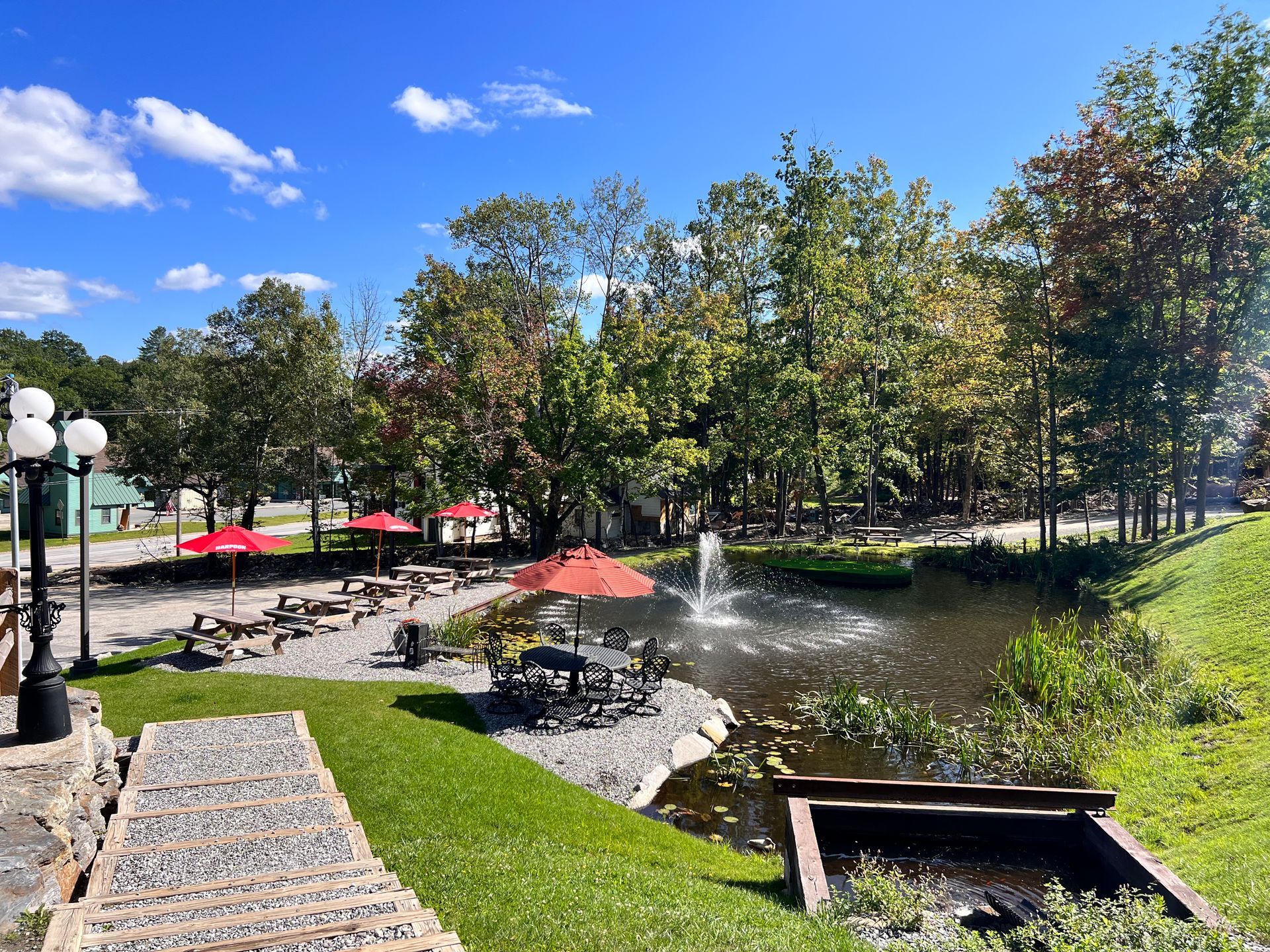 There is a fountain in the middle of the park.