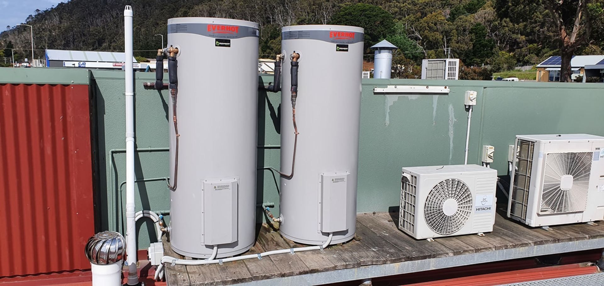 a plumber is fixing a sink pipe with a wrench.