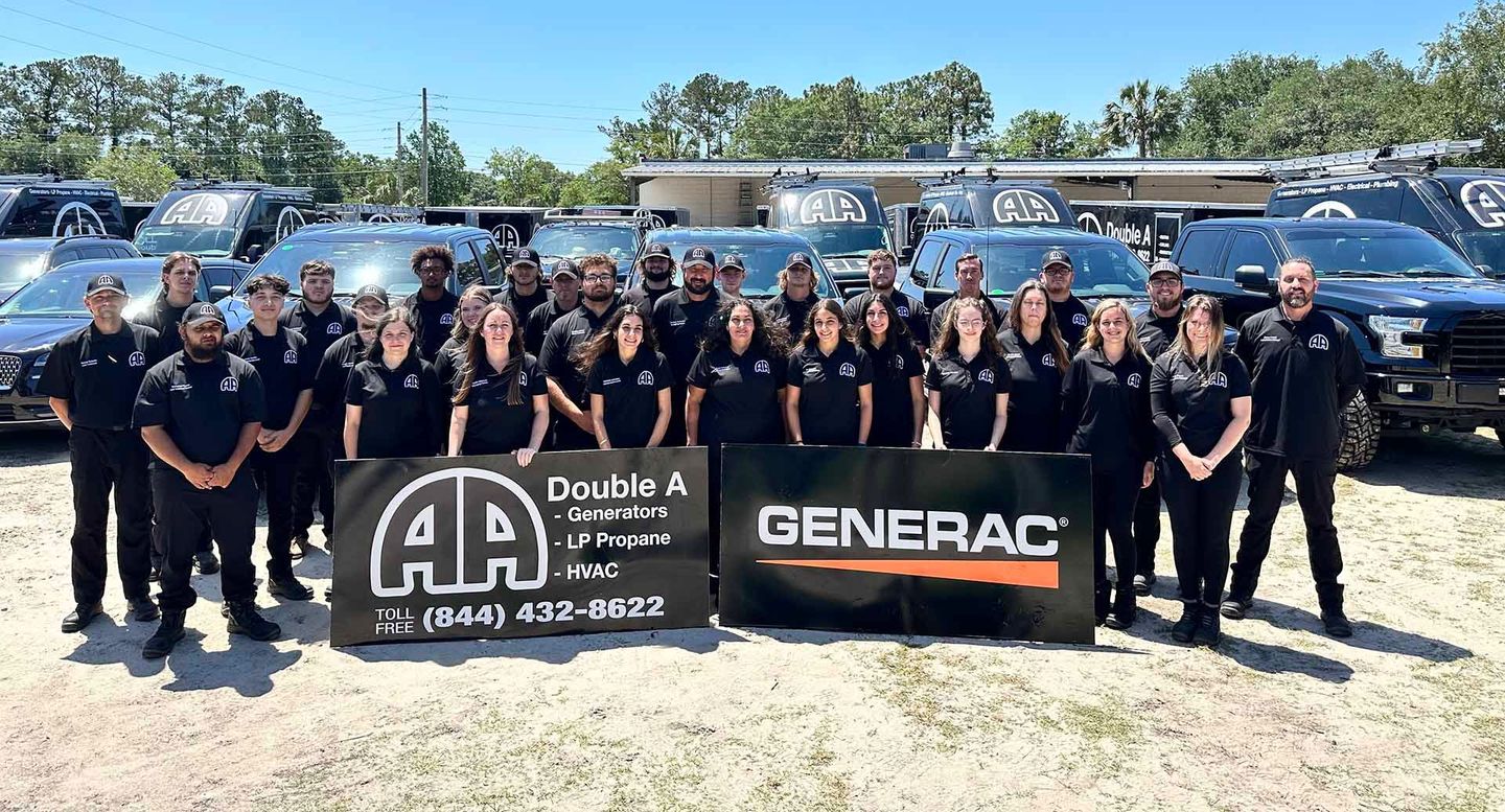 A group of people are posing for a picture in front of a generator.