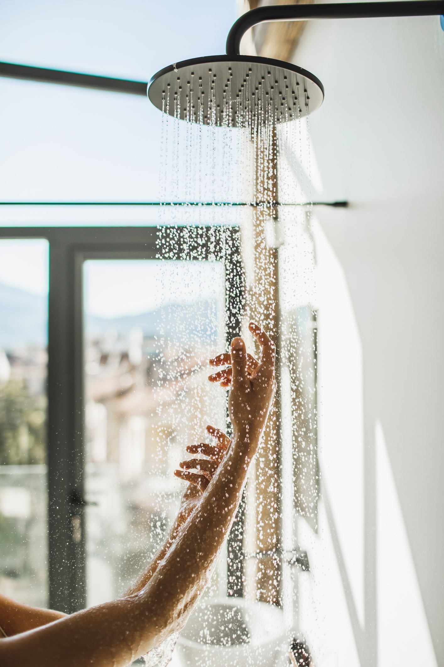 A water treatment system is installed on the side of a house.