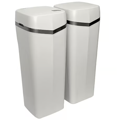 Two white water softeners are sitting next to each other on a white background.