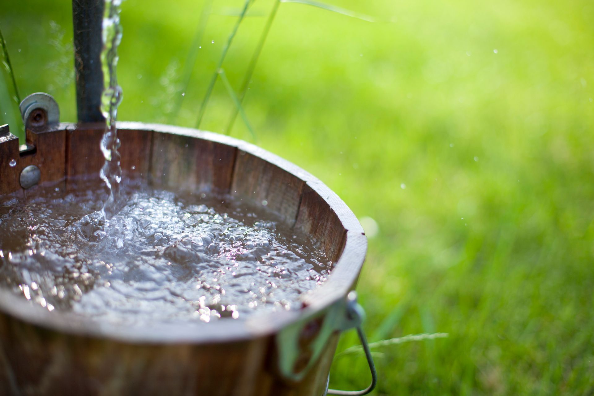 A water treatment system is installed on the side of a house.