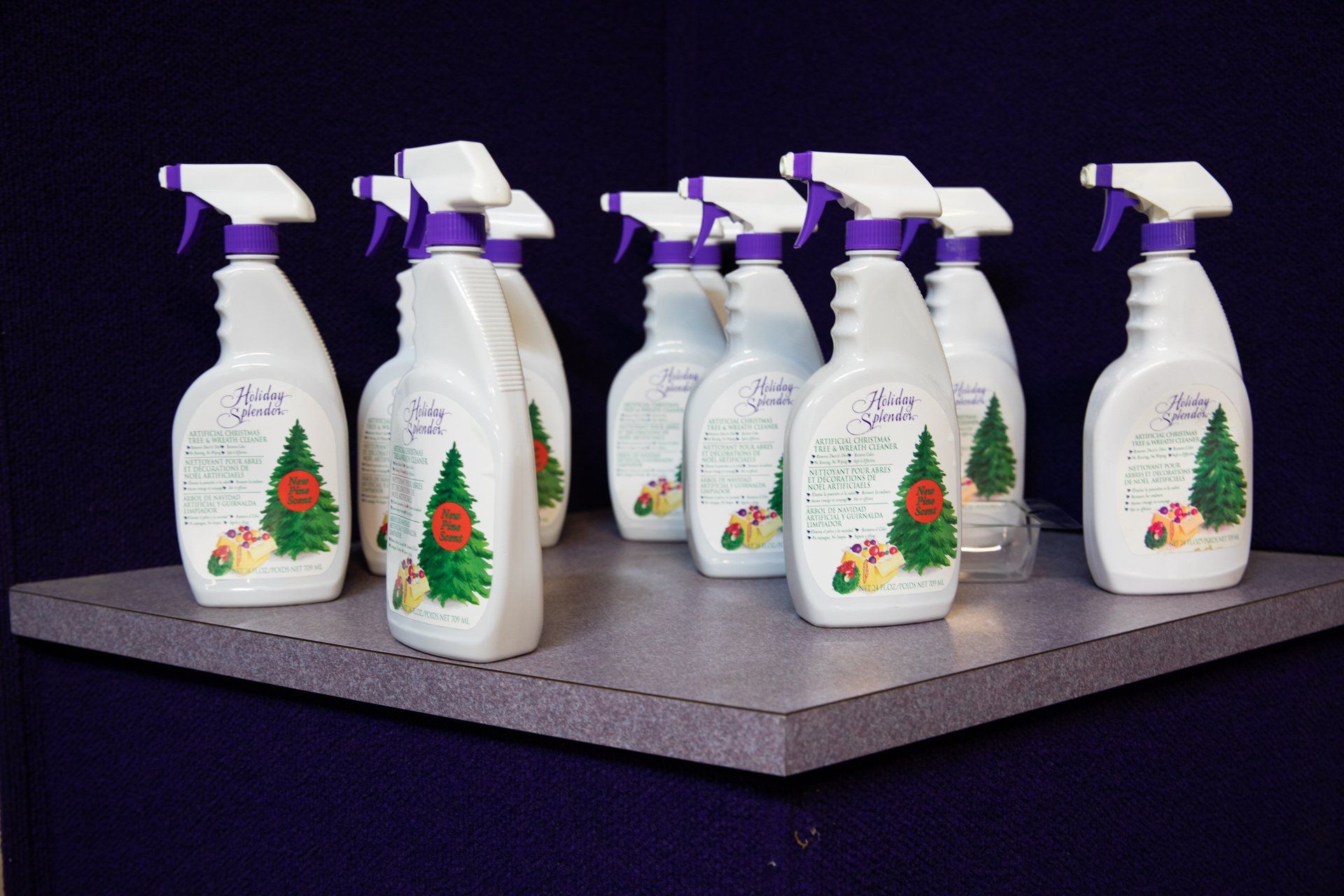 A row of spray bottles with christmas trees on them