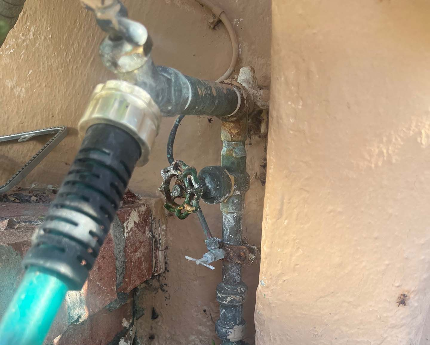 Outdoor water pipes with attached hose