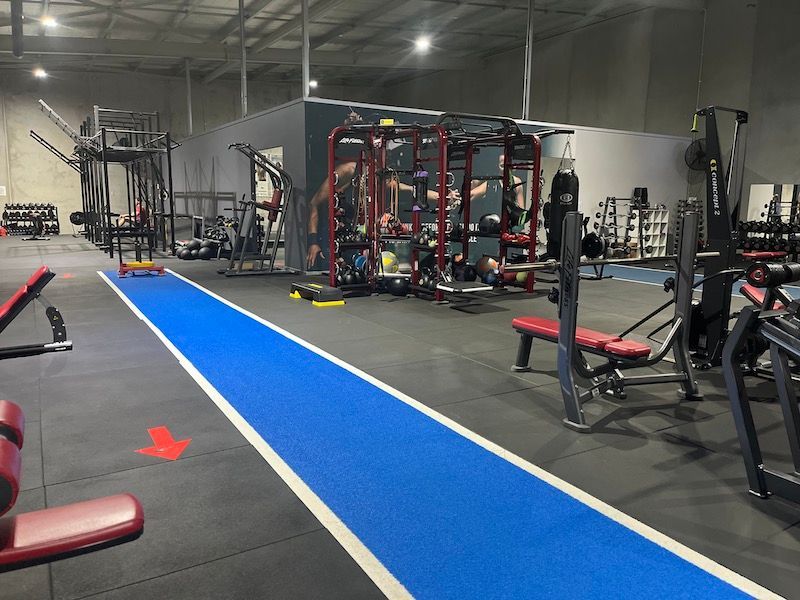 Fit People On Exercise Bicycle With Trainer — Fitness Studio & Gym in Sebastopol