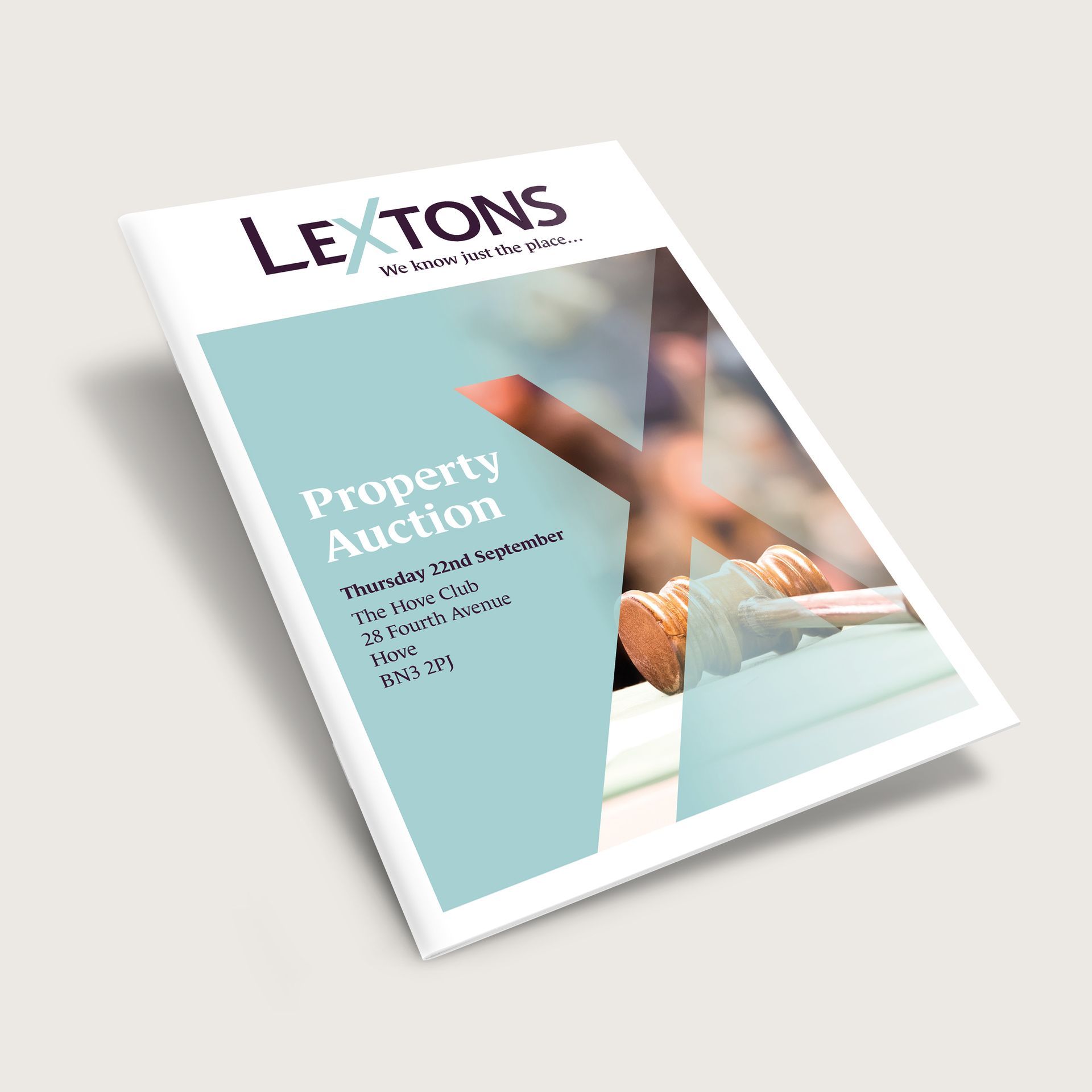 A book titled lextons property auction is sitting on a table.