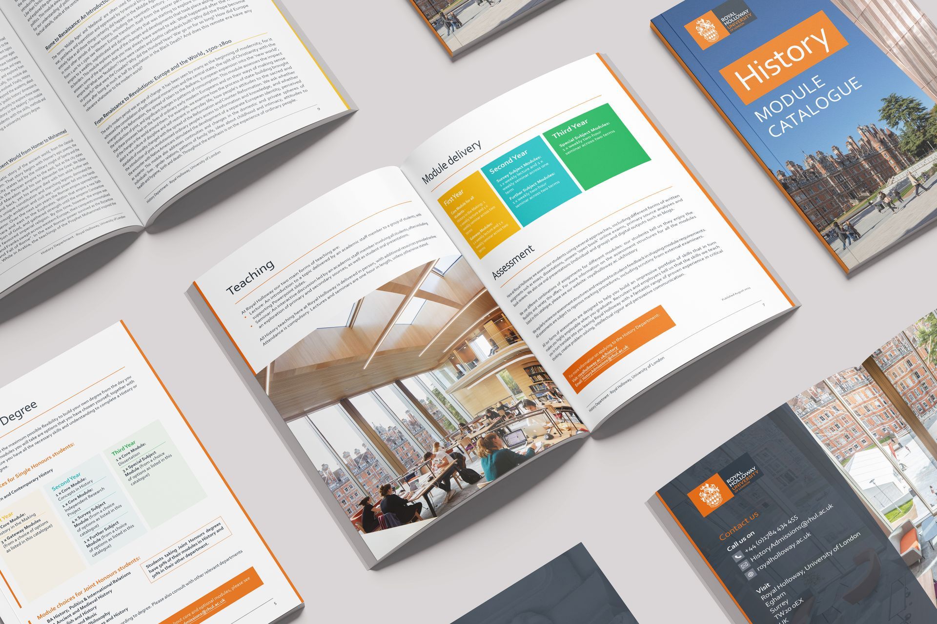 A group of books are sitting on top of each other on a table.