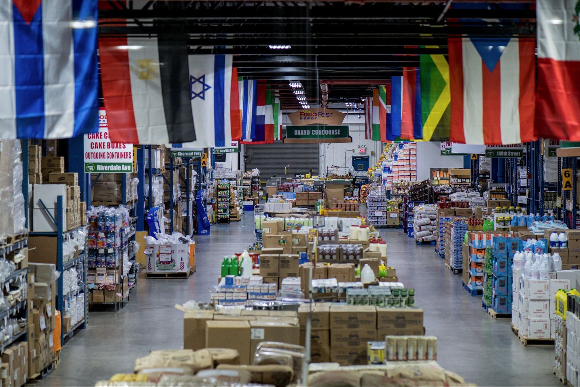 A large store filled with lots of boxes and flags hanging from the ceiling.