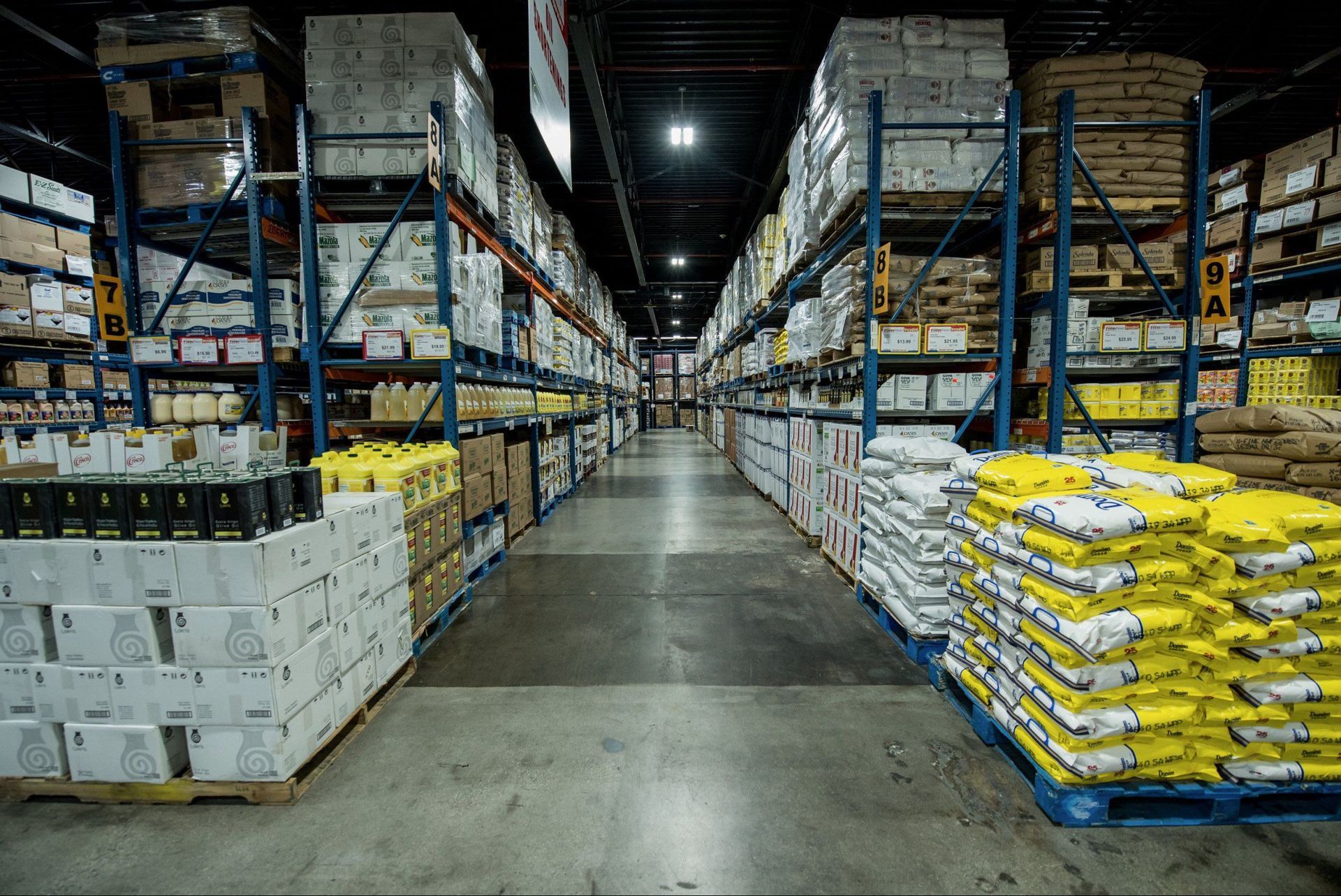 A large warehouse filled with lots of boxes and bags.
