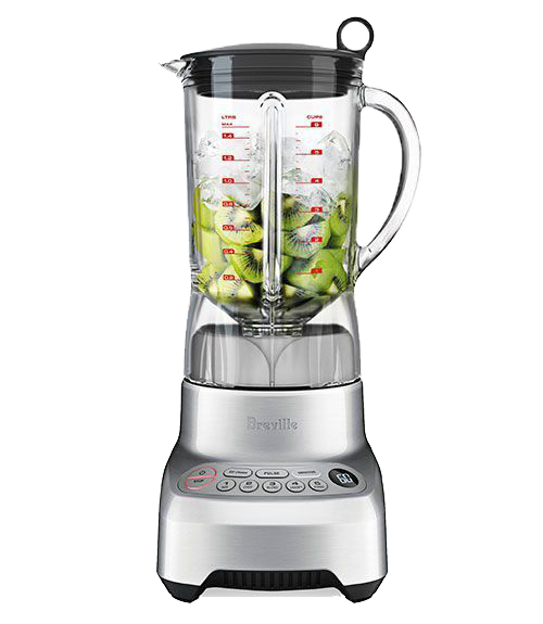 A blender with vegetables in it on a white background.