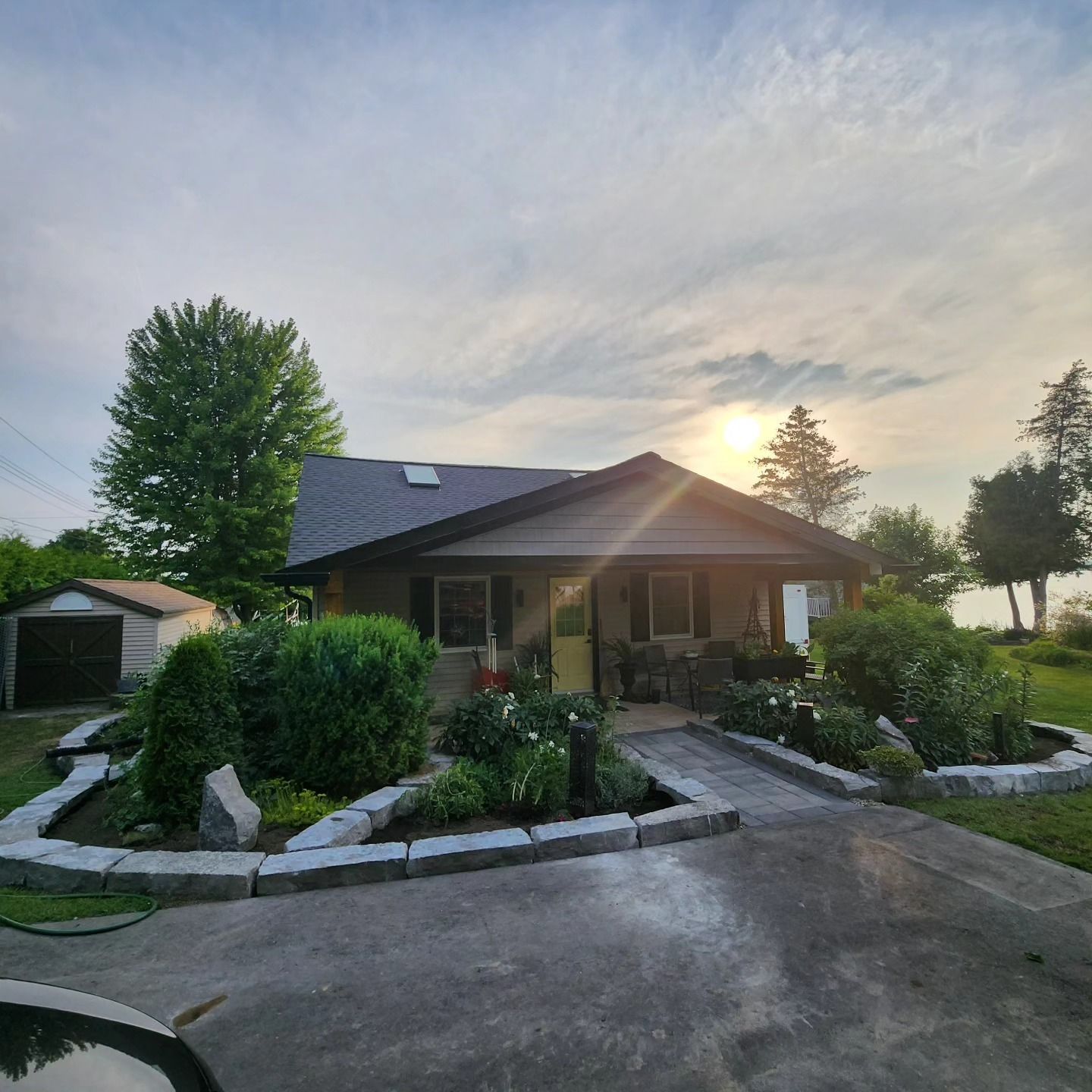 A house with a lot of plants in front of it