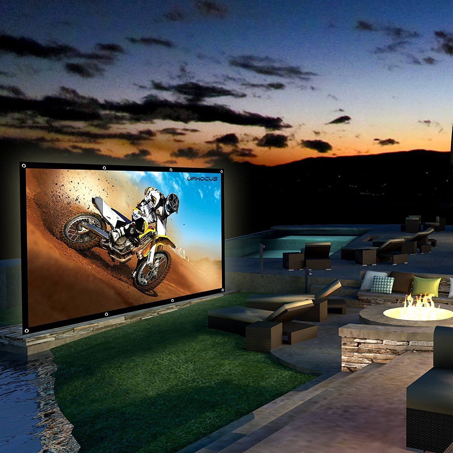 A large screen shows a man riding a dirt bike