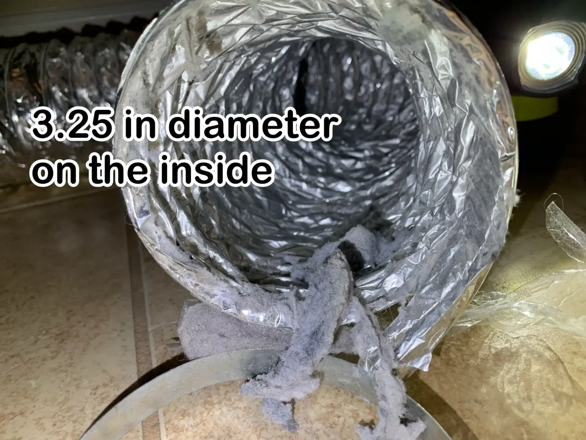 Love's Dryer Vent Cleaning - A close up of a duct with a 3.25 in diameter on the inside.