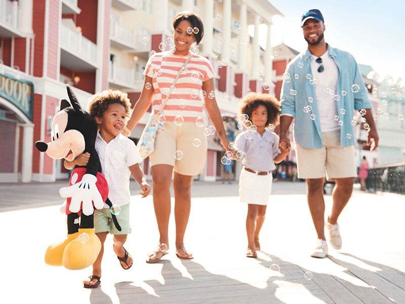 A family enjoys the sights and sounds of a resort.