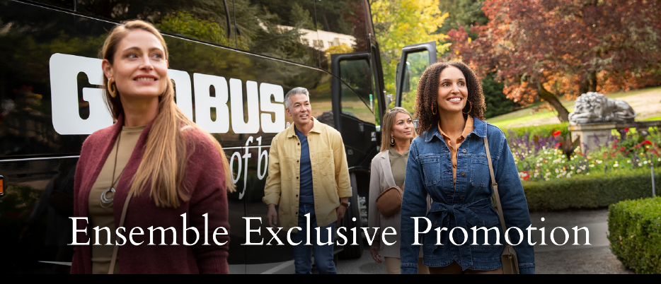 A group of people standing in front of a Globus tour bus.