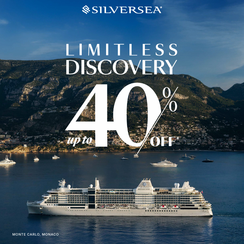 Silversea cruise ad: Ship on water, mountains in background. 