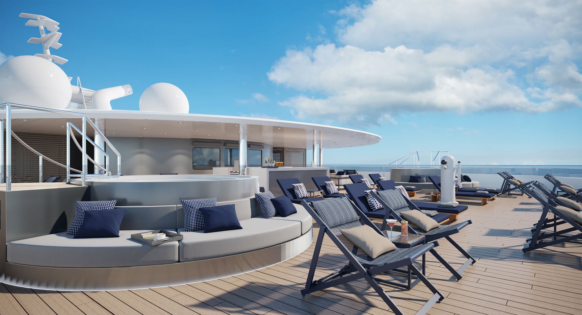 A sunny, modern cruise ship deck featuring a circular seating area, a hot tub, and multiple lounge chairs on a wooden floor.
